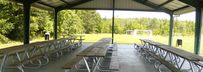Interior of picnic shelter in a park with tables