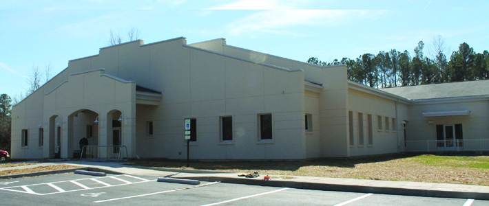 Front of white one story building